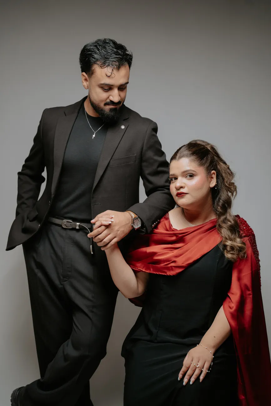 Maha and Kashif holding hands